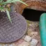 a septic pump runs into a septic tanks to clean it out for a residential homeowner