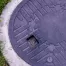 a close up image of a septic system tank with green grass